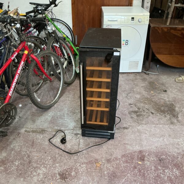 Black wine cooler with glass door, ideal for beverage storage.