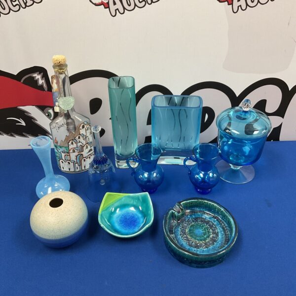 Blue art glass collection with studio pottery bowl.