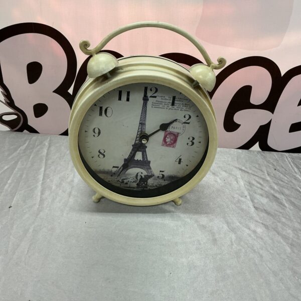 Vintage Blue Moon Paris clock with a round face and bold numerals.