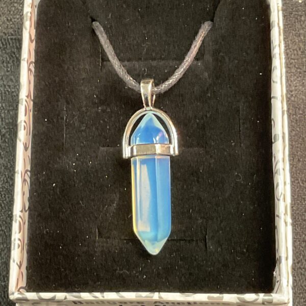 Blue moonstone pendant necklace on black rope, gemstone jewellery.