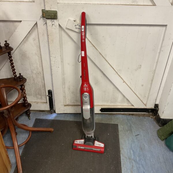 Red Bosch Athlet cordless vacuum cleaner for home cleaning.