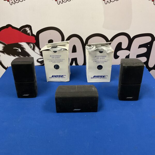 Vintage Bose Acoustimass cube speakers for home audio.