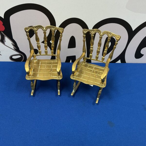Pair of miniature brass rocking chairs, vintage collectible decor.