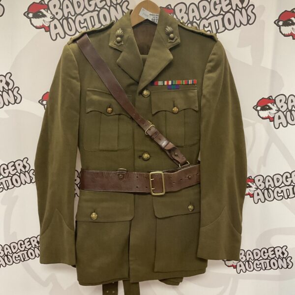 British Army officer uniform jacket with medals and insignia.