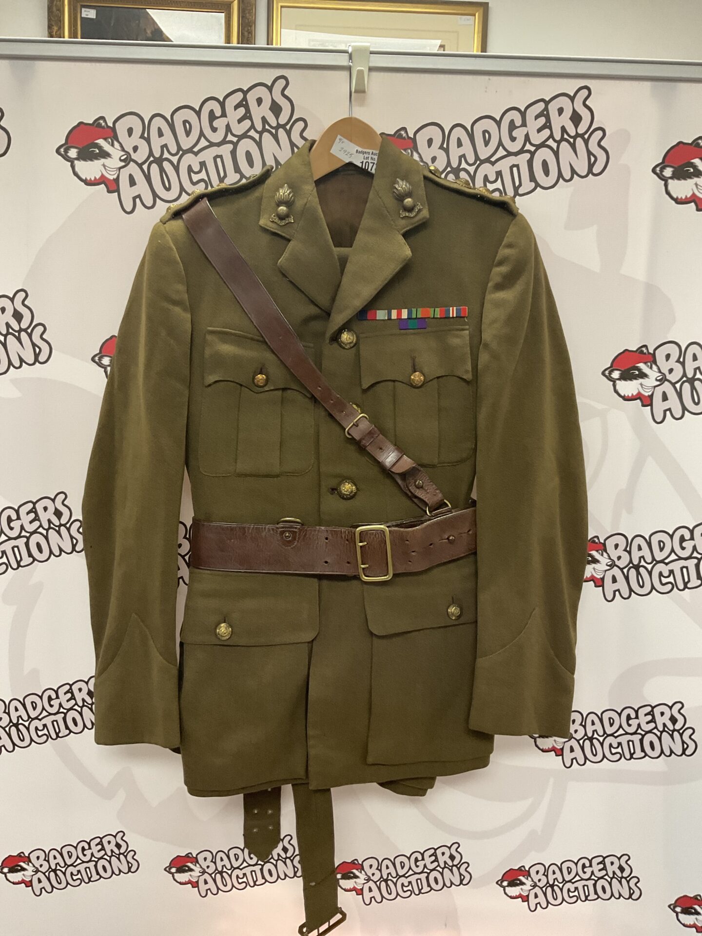 British Army officer uniform jacket with medals and insignia.