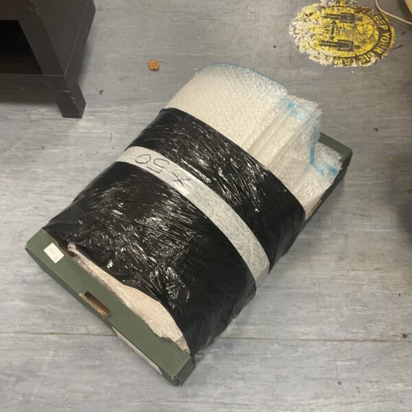 Stack of fifty large bubble bags for protective packaging.