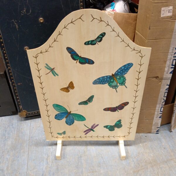 Vintage wooden fireguard with colourful butterfly decoupage design.