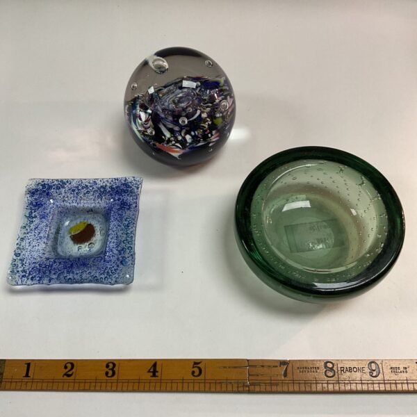 Vibrant Caithness Glass paperweight with colourful inclusions.