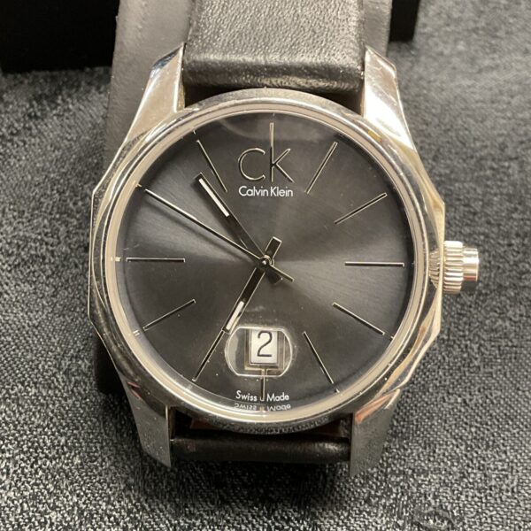 Calvin Klein Swiss made watch with black dial and leather strap.
