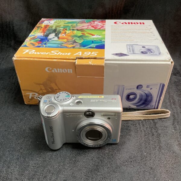Canon PowerShot A95 digital camera with original box and instructions.