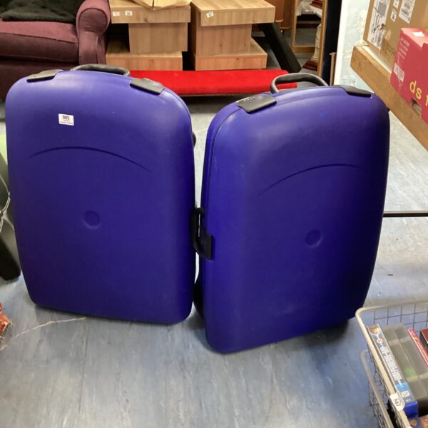 Vintage blue Carlton suitcases, classic travel luggage.