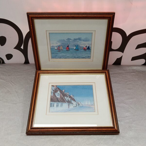 Pair of Carolyn Pavey Smith sailboat prints in framed coastal art.