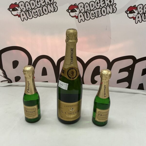 Set of Carpenter Champagne bottles, including a full-sized and miniatures.