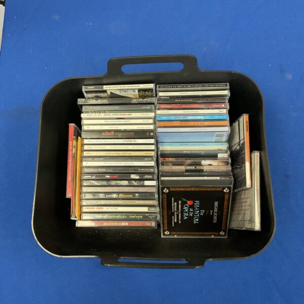 Mixed lot of CDs including Eminem, Michael Jackson, and Robbie Williams albums.