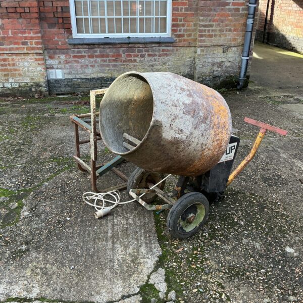 Portable cement mixer with tip-up design for garden and DIY projects.
