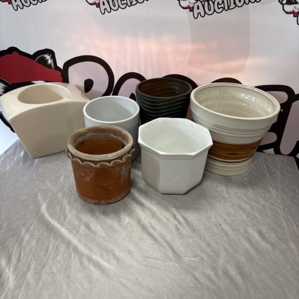 Selection of small ceramic plant pots including terracotta options.