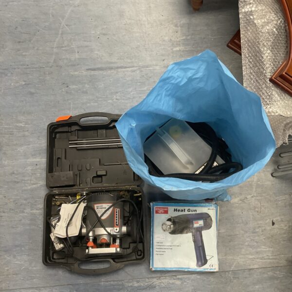 Black carrying case containing a Challenge Xtreme tool kit with heat gun.