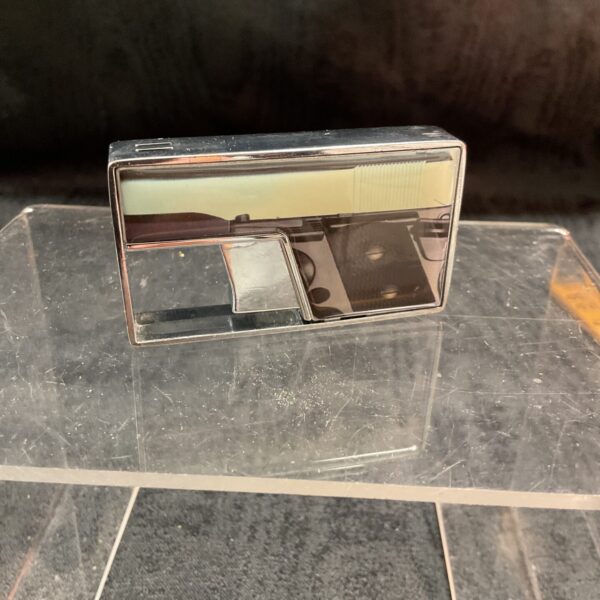 Vintage Champ pistol lighter, collectible gas powered accessory.