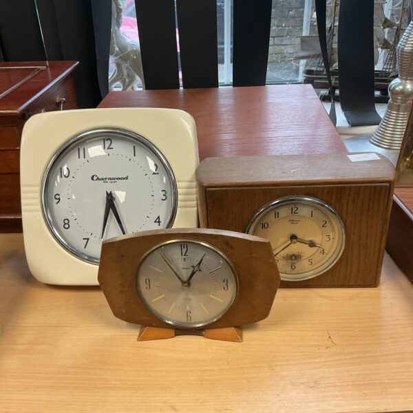 Vintage Charnwood wall clock with textured face and bold numerals.