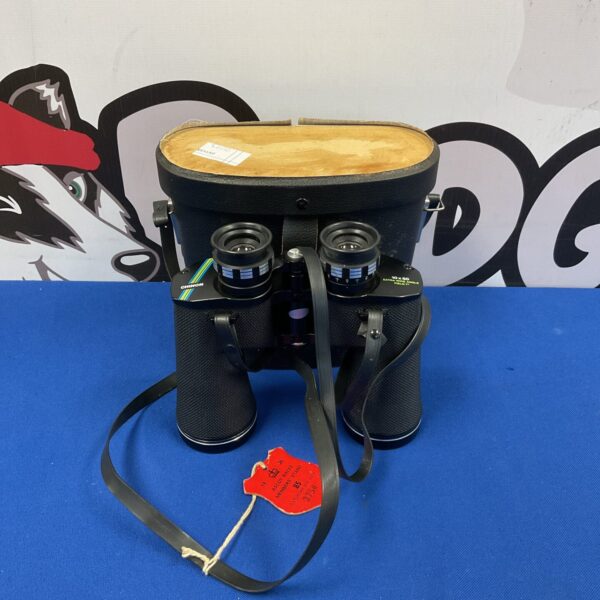 Vintage Chinon 10x50 binoculars in black, side view.