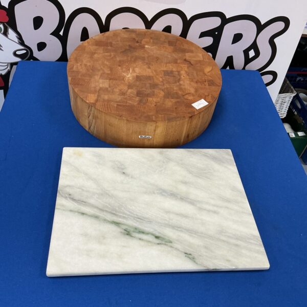 Vintage chopping block set with marble board for kitchen prep.