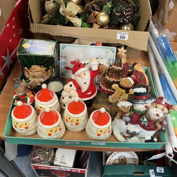 A box of colourful Christmas decorations including Santa egg cups.