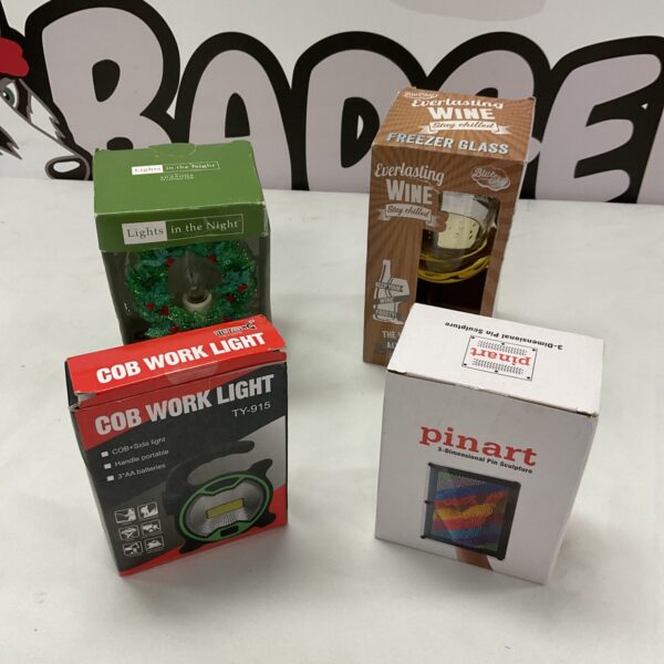 Christmas light set with wine glass, pinart, and worklight.