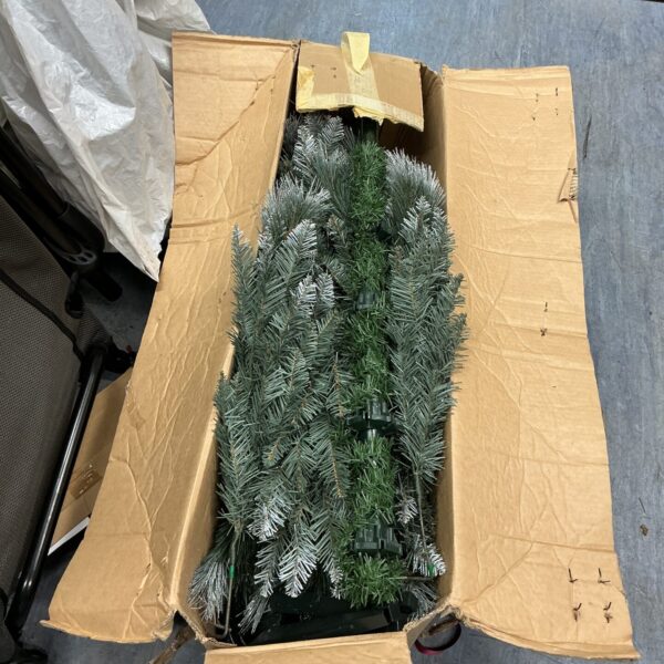 Spruce effect 5ft Christmas tree inside a cardboard box.