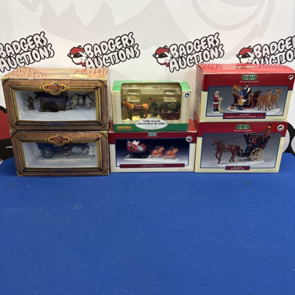 Boxed Christmas village decorations from Lemax and Luville, festive holiday decor.