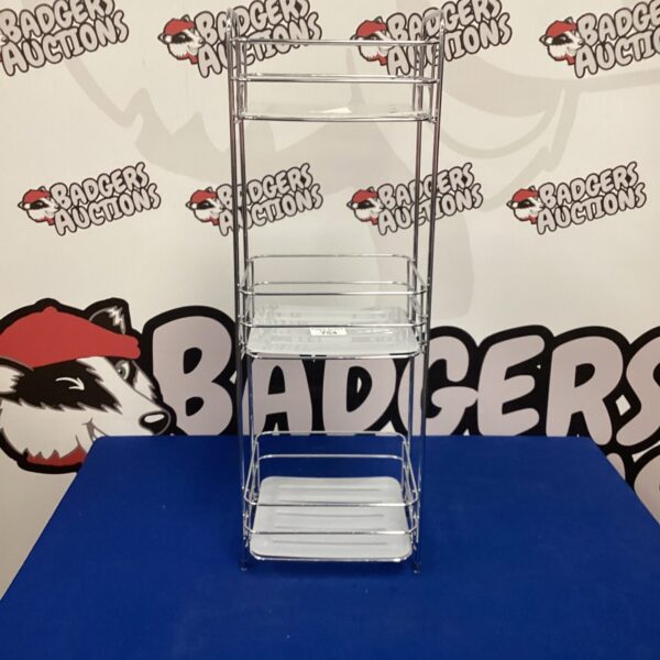 Chrome bathroom storage rack with tiered shelves.