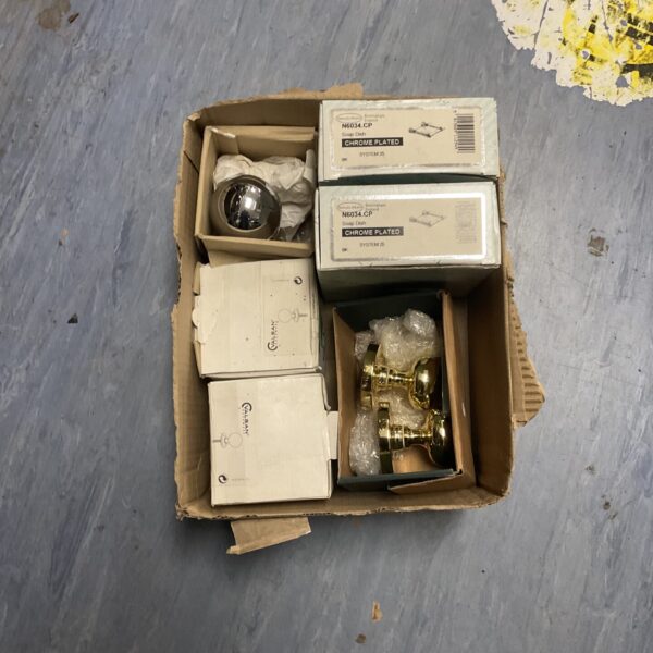 Selection of chrome and brass door knobs and fittings.