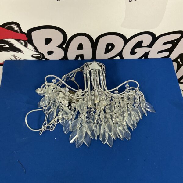 Vintage chrome and glass chandelier with cascading crystals.