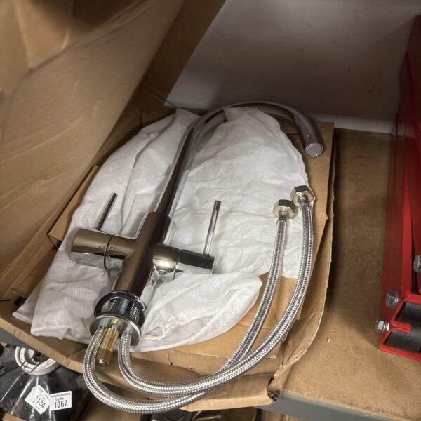 Chrome swan neck kitchen mixer tap with flexible hoses.