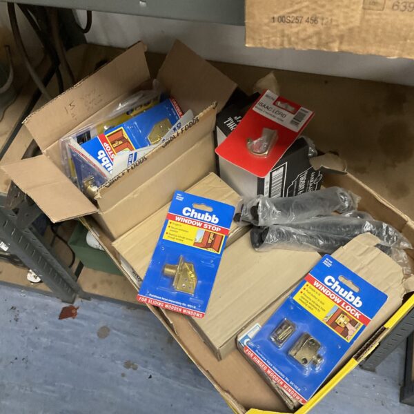 Tray of vintage Chubb window locks and stops for restoration.