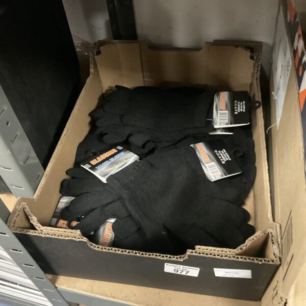 Tray of new black Classics magic stretch gloves in packaging.