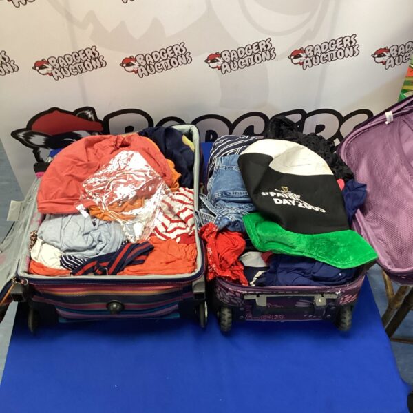 Full suitcases packed with a diverse clothing lot.