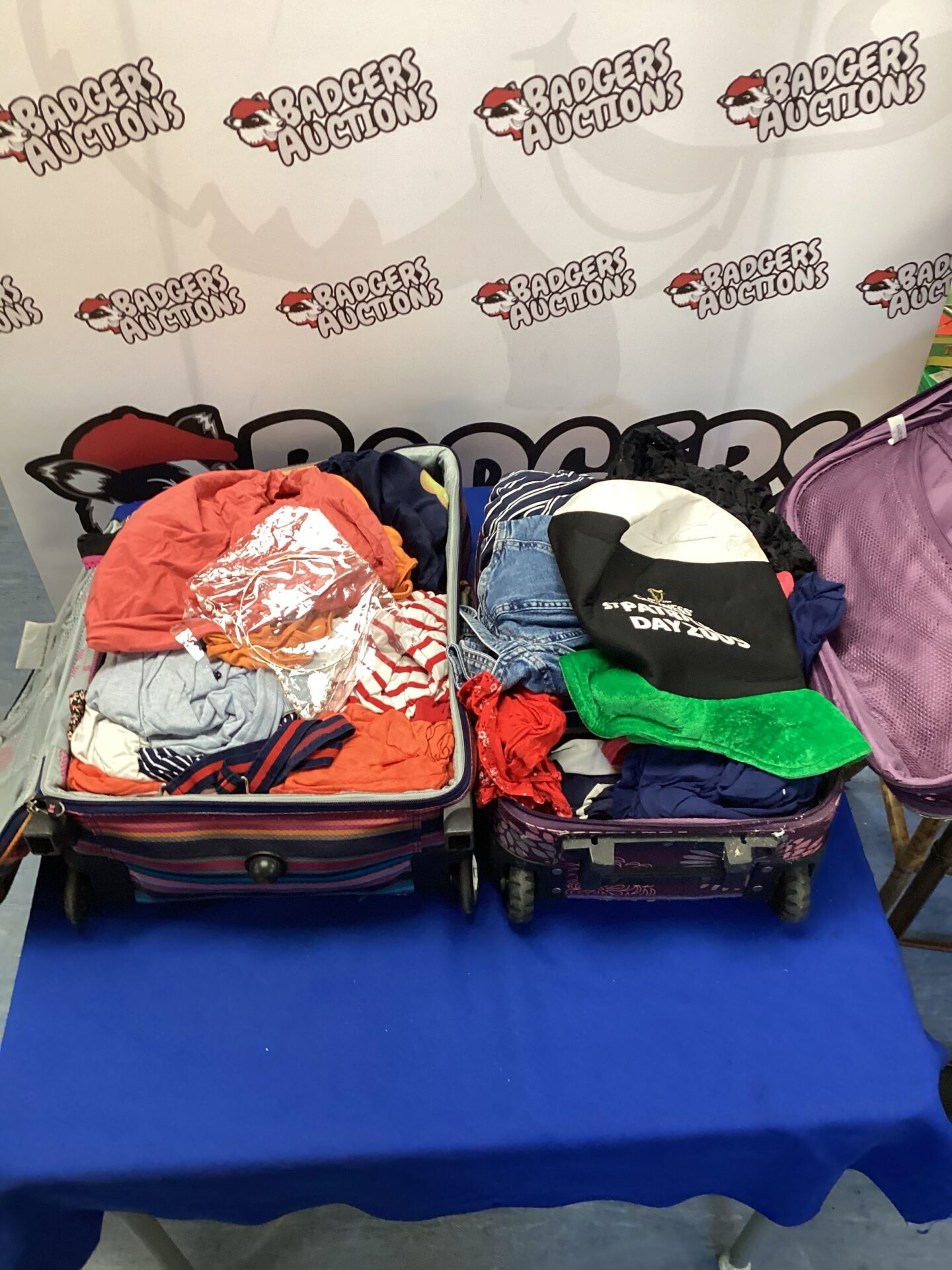 Full suitcases packed with a diverse clothing lot.