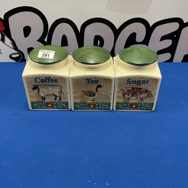 Vintage Cloverleaf tea, coffee, and sugar jars set for kitchen storage.