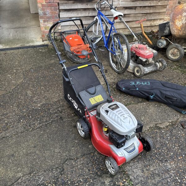 Used Cobra 135cc petrol lawnmower for garden maintenance.