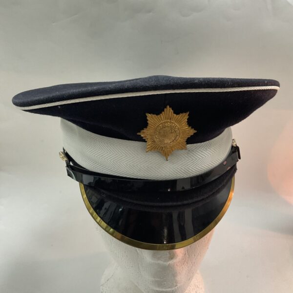 Vintage Coldstream Guards peaked cap from 1986, detailed view.