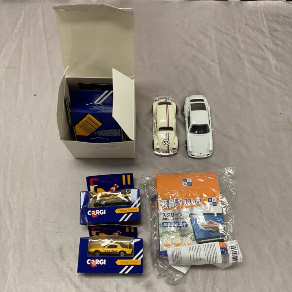 Vintage Corgi model cars, Beetle and Porsche, diecast collection.