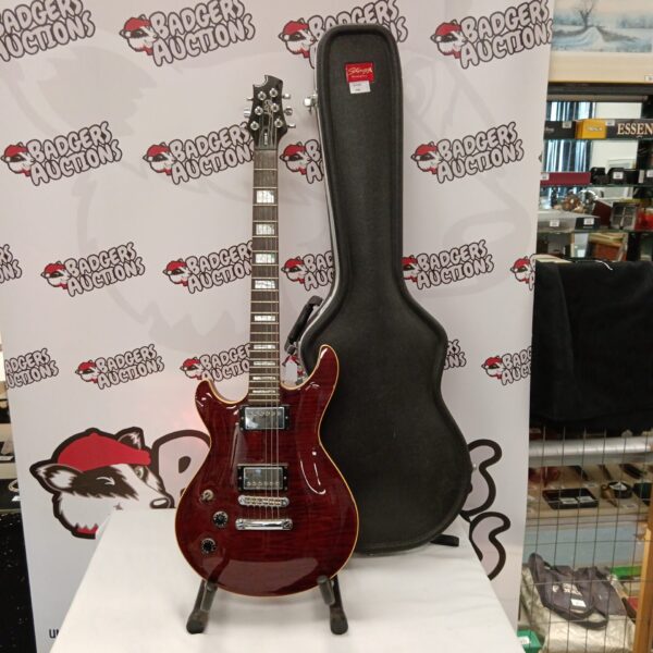 Left-handed Cort M600 electric guitar with Stagg hard case.