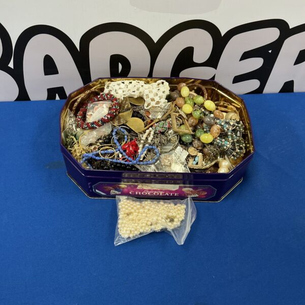 Assorted costume jewellery tray with necklaces and bracelets.