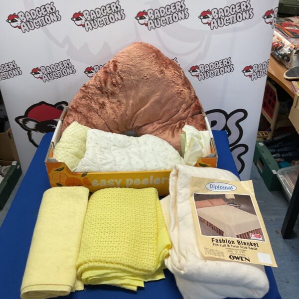 Collection of patterned cot blankets for baby care.