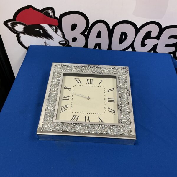 Stunning 34cm crushed mirror wall clock for modern home decor.