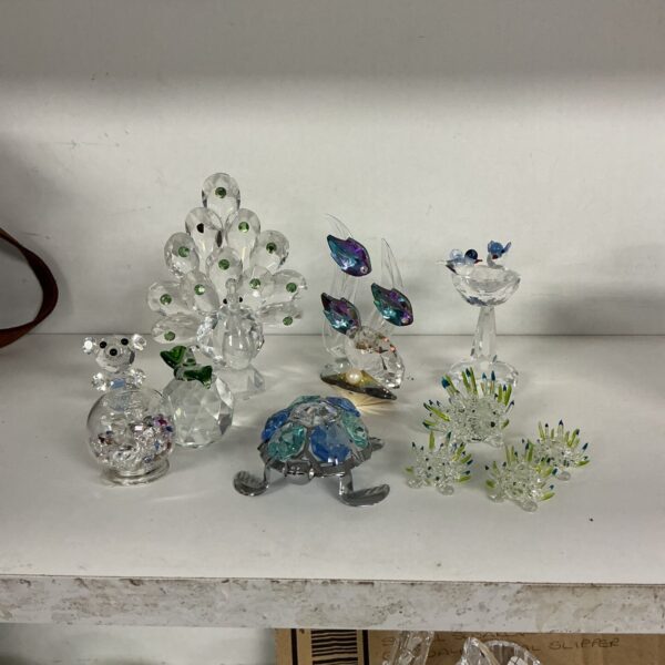 Colourful crystal animal collection featuring peacock and hedgehogs.
