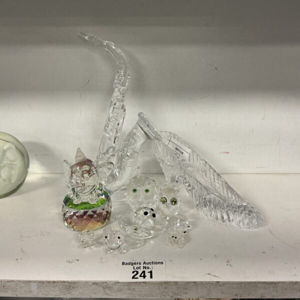 Crystal slipper and Disney Dumbo figurine from a collectible collection.