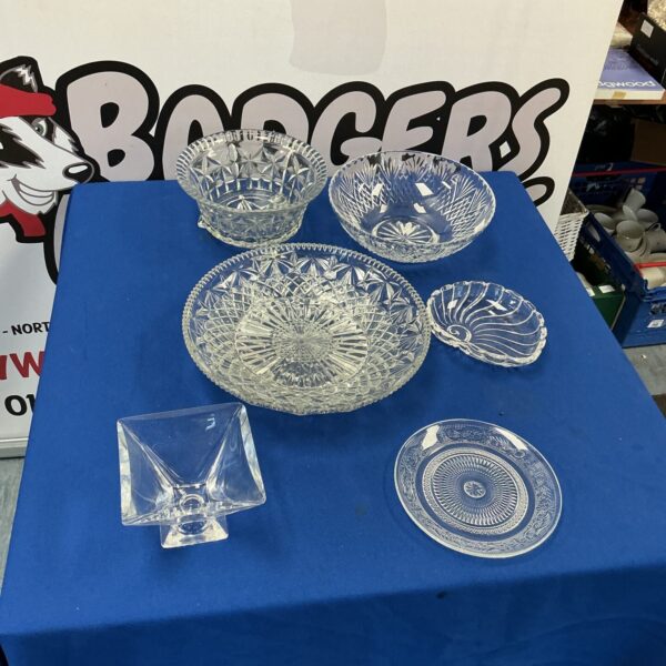 Selection of vintage cut glass and crystal items on display.