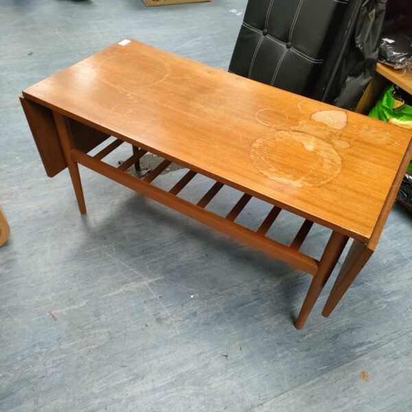 Mid-century Danish drop leaf coffee table in teak wood.
