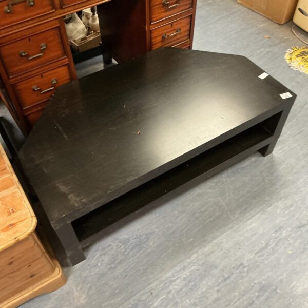 Dark wood TV unit with modern design and storage space.